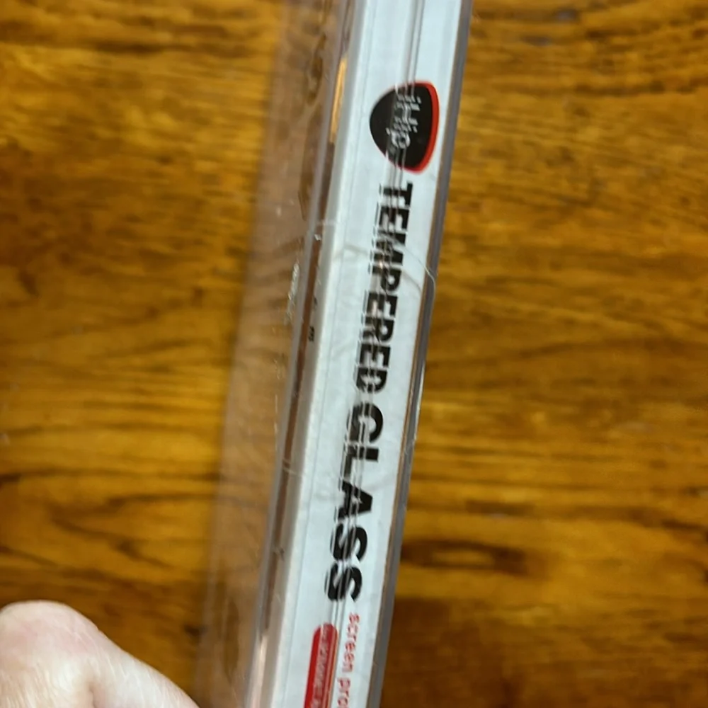NWT. (New with tape intact). Never opened. Tempered glass iPhone 6/6s